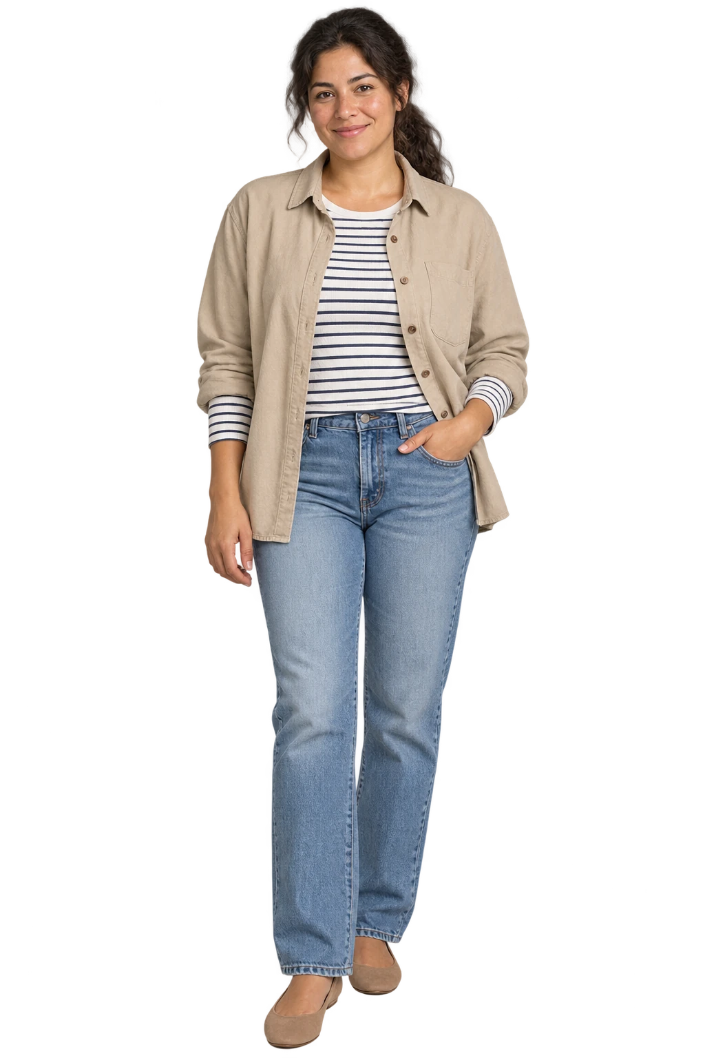 A woman in a striped long-sleeved top, sand overshirt, straight blue jeans and comfortable flats