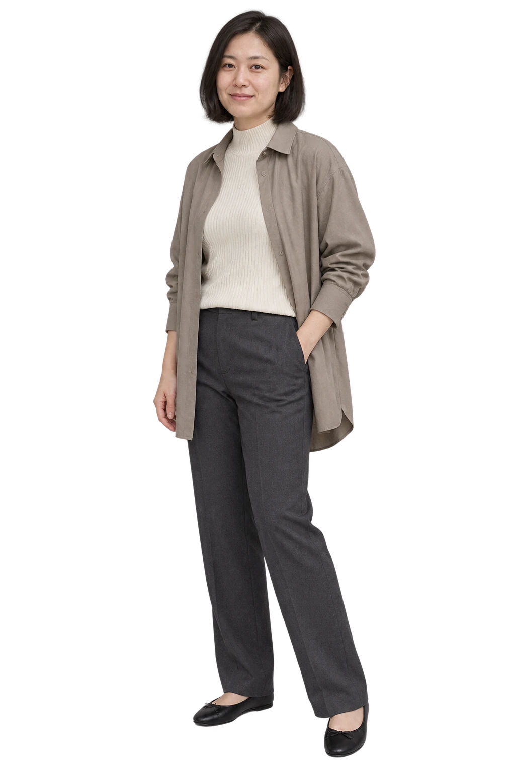 A woman in an ivory high-neck knit, greige overshirt, charcoal trousers and black flats